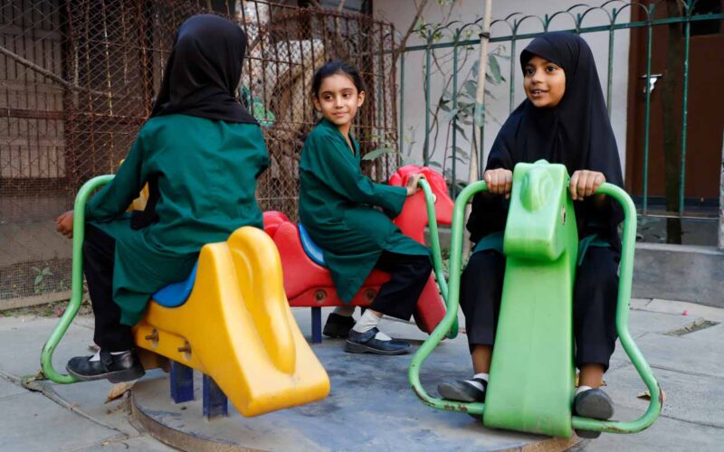 Bonoful School Uttara Childrens are sitting in horse toy