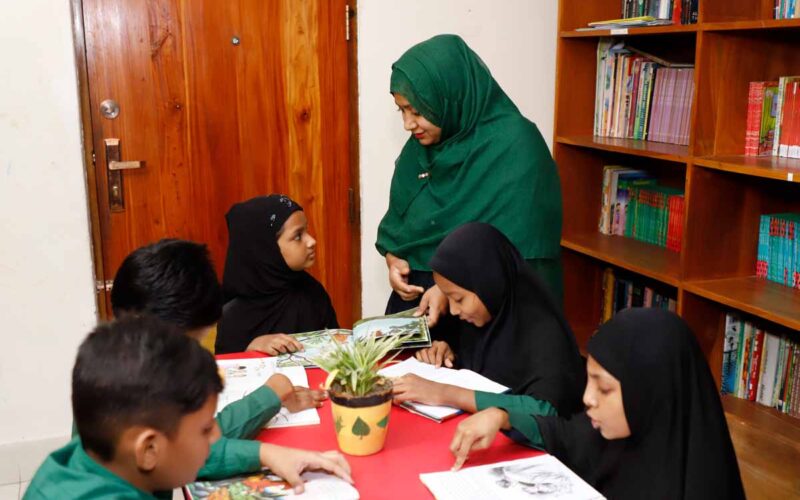 Bonoful Mohammapur Teacher Helping The Student For Learning In Library At Mohammadpur