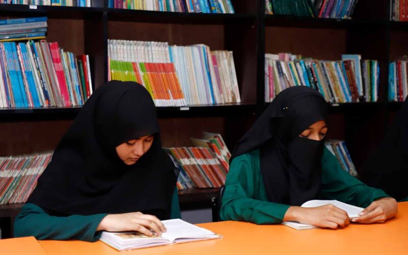 Women Learning Attentively In Library